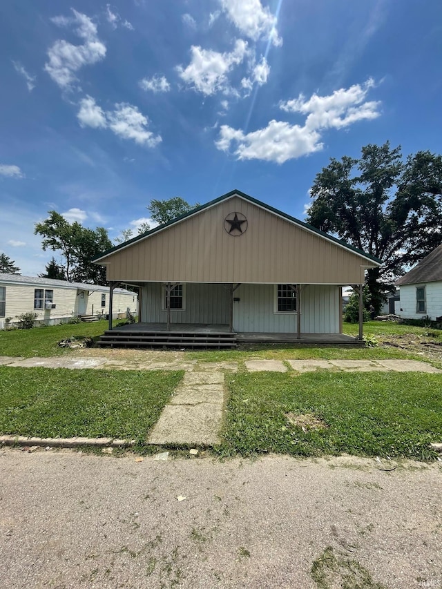 312 E 2nd St, Bicknell, IN 47512 - view of front of home featuring a front lawn and a porch