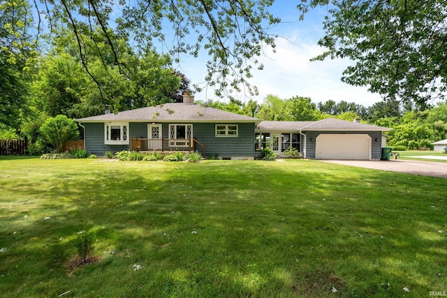 51881 Currant Rd, Granger, IN 46530 - ranch-style home featuring a garage, driveway, a chimney, and a front yard