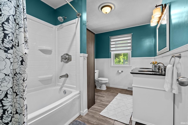 51881 Currant Rd, Granger, IN 46530 - full bath with a wainscoted wall, shower / tub combo with curtain, vanity, and wood finished floors