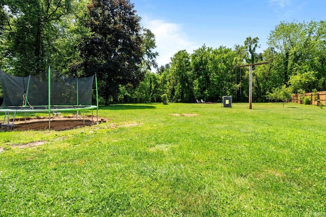 51881 Currant Rd, Granger, IN 46530 - view of green lawn with a trampoline