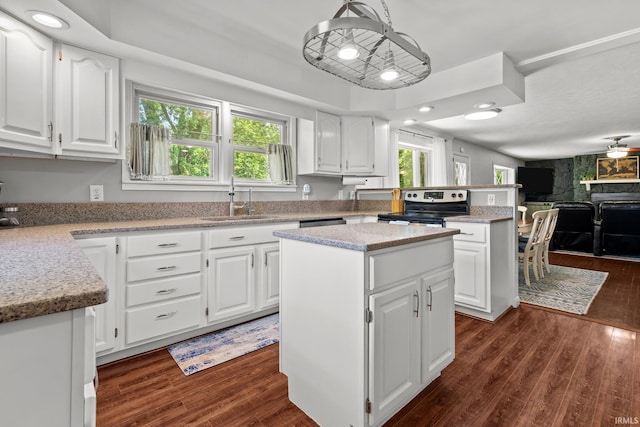 51881 Currant Rd, Granger, IN 46530 - kitchen featuring electric range, dark wood-type flooring, a kitchen island, and white cabinets