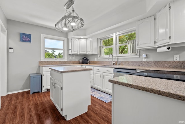 51881 Currant Rd, Granger, IN 46530 - kitchen featuring dark wood-style flooring, white cabinets, a kitchen island, and pendant lighting