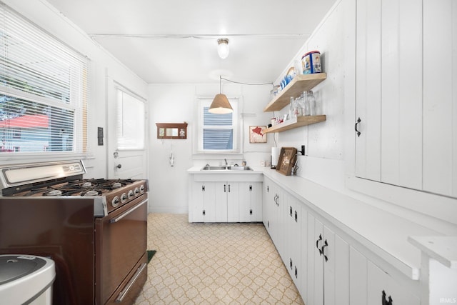 387 Ems T26 Ln, Leesburg, IN 46538 - kitchen with stainless steel gas range oven, light countertops, light floors, white cabinetry, and open shelves