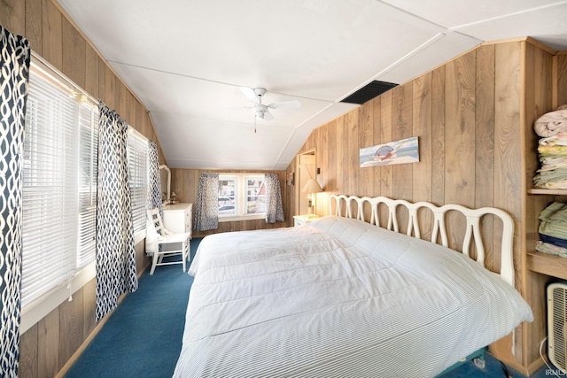 387 Ems T26 Ln, Leesburg, IN 46538 - carpeted bedroom featuring wood walls, lofted ceiling, and ceiling fan
