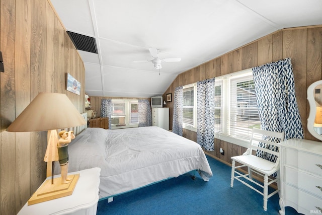 387 Ems T26 Ln, Leesburg, IN 46538 - bedroom featuring vaulted ceiling, wood walls, carpet flooring, and a ceiling fan