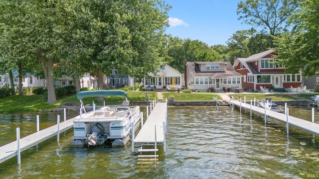 387 Ems T26 Ln, Leesburg, IN 46538 - dock area with a water view, boat lift, a residential view, and a yard