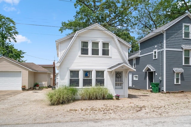 387 Ems T26 Ln, Leesburg, IN 46538 - dutch colonial featuring a gambrel roof, concrete driveway, and an outbuilding