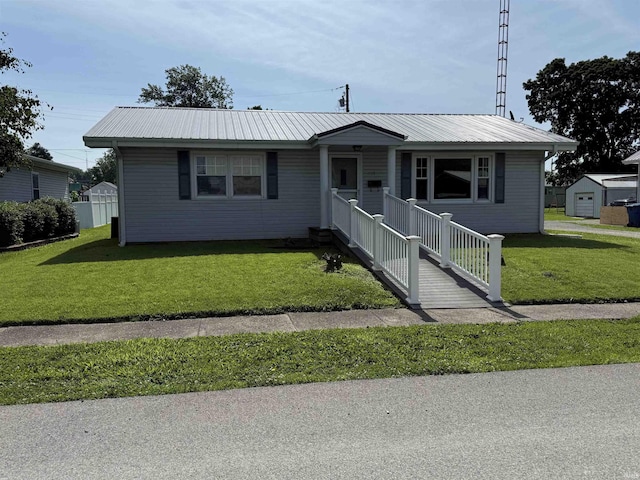 305 S Grove St, Odon, IN 47562 - view of front of house featuring a front lawn, a metal roof, and a porch