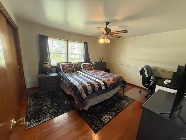 305 S Grove St, Odon, IN 47562 - bedroom with wood finished floors, an office area, a ceiling fan, and a closet