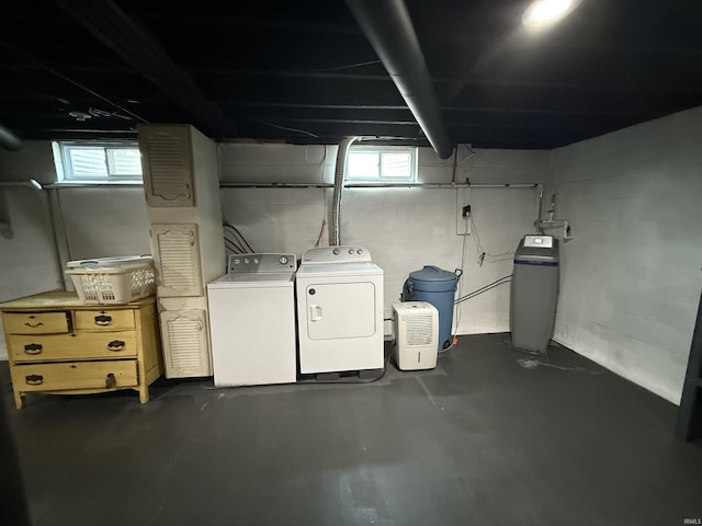 305 S Grove St, Odon, IN 47562 - below grade area featuring a water softener system, separate washer and dryer, and plenty of natural light