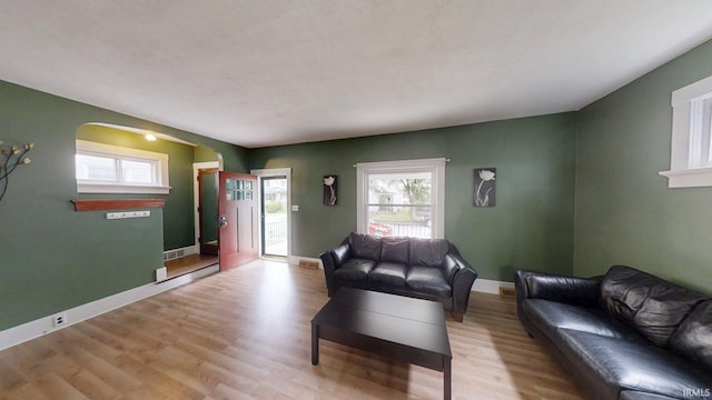1219 Oakland St, Fort Wayne, IN 46808 - living room with wood finished floors and arched walkways