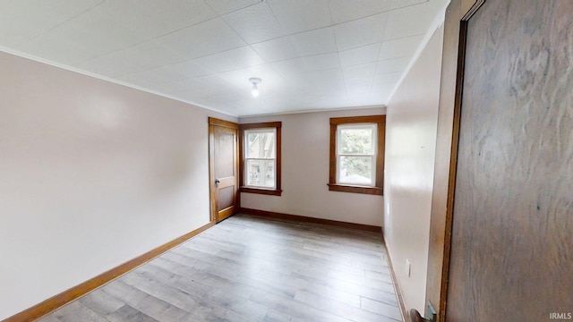 1219 Oakland St, Fort Wayne, IN 46808 - spare room with light wood finished floors and crown molding