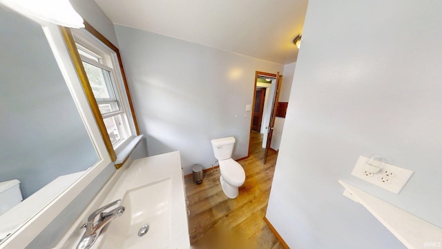 1219 Oakland St, Fort Wayne, IN 46808 - half bath featuring toilet and wood finished floors