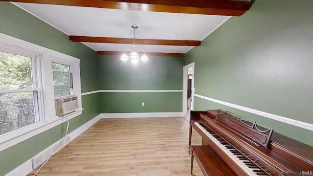1219 Oakland St, Fort Wayne, IN 46808 - unfurnished room with beamed ceiling, a chandelier, wood finished floors, and cooling unit