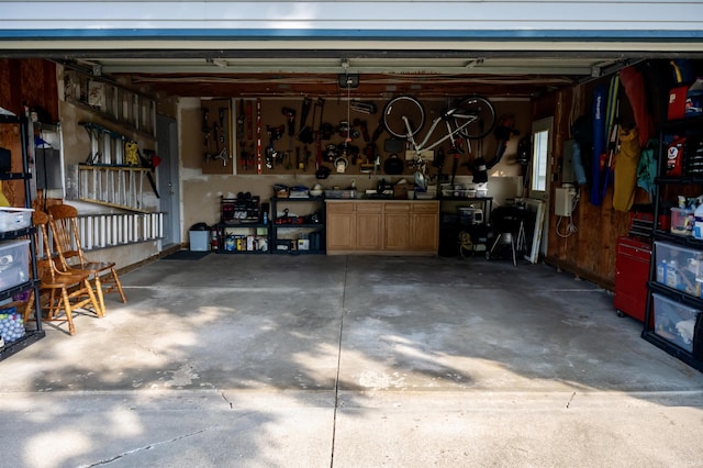27222 Country Lake Ln, Elkhart, IN 46514 - garage with a workshop area and a garage door opener