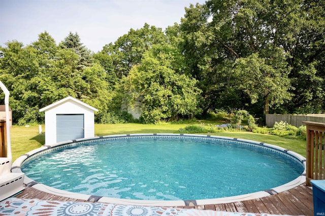 27222 Country Lake Ln, Elkhart, IN 46514 - outdoor pool featuring a yard, a shed, a wooden deck, and view of scattered trees