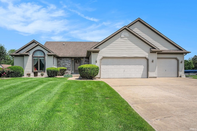 51172 Channel Ct, Elkhart, IN 46514 - ranch-style home featuring concrete driveway, a garage, a front yard, and stone siding