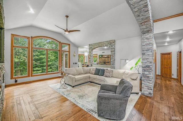 55623 Little Creek Ln, Middlebury, IN 46540 - living area featuring hardwood / wood-style flooring, ornate columns, a ceiling fan, plenty of natural light, and lofted ceiling