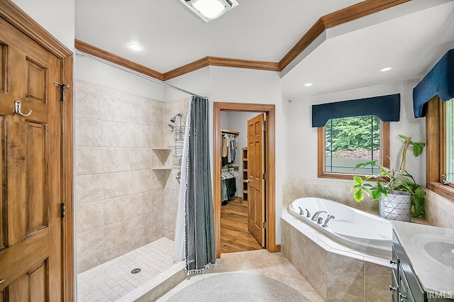 55623 Little Creek Ln, Middlebury, IN 46540 - full bathroom featuring ornamental molding, a bath, a shower stall, vanity, and tile patterned flooring