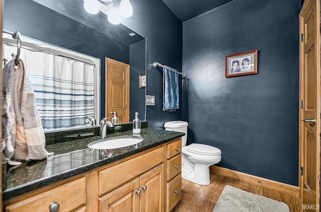 55623 Little Creek Ln, Middlebury, IN 46540 - bathroom with wood finished floors, vanity, and a shower with shower curtain
