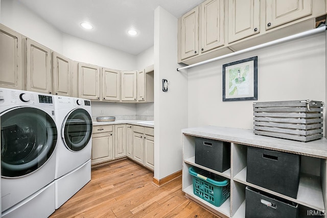 55623 Little Creek Ln, Middlebury, IN 46540 - laundry room featuring washing machine and dryer, light wood-style flooring, cabinet space, and recessed lighting