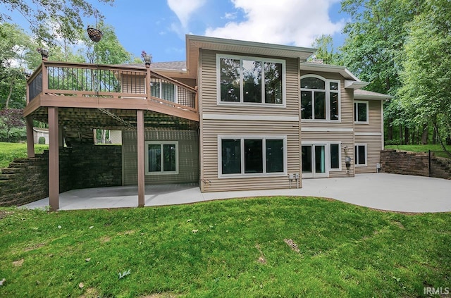 55623 Little Creek Ln, Middlebury, IN 46540 - back of property with a lawn, a patio area, and a deck