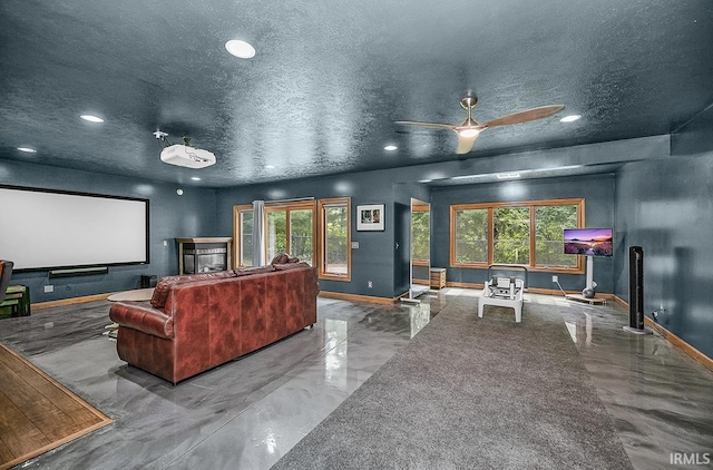 55623 Little Creek Ln, Middlebury, IN 46540 - home theater featuring recessed lighting, healthy amount of natural light, ceiling fan, a textured ceiling, and marble tiled flooring