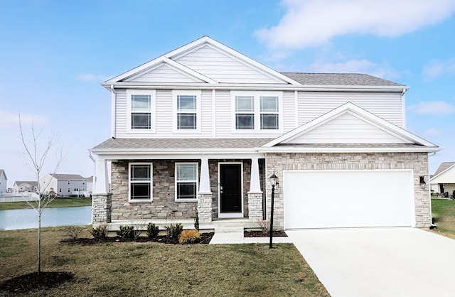 10305 Woodsong Cv, New Haven, IN 46774 - craftsman house with covered porch, a front yard, driveway, and a garage