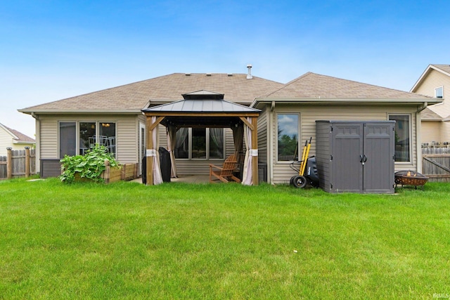 1108 Willen Ln, Fort Wayne, IN 46818 - back of property featuring a gazebo, roof with shingles, and a storage shed