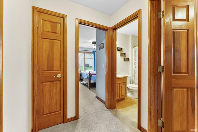 1108 Willen Ln, Fort Wayne, IN 46818 - hallway with light colored carpet and baseboards