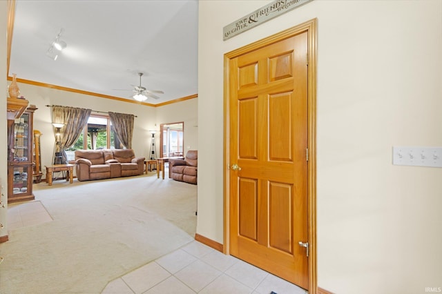 1108 Willen Ln, Fort Wayne, IN 46818 - foyer entrance with a ceiling fan, light carpet, light tile patterned floors, ornamental molding, and rail lighting