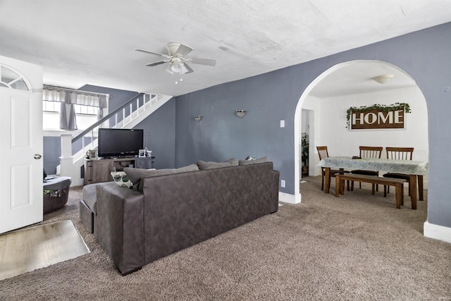 225 N E St, Marion, IN 46952 - living room with a ceiling fan, arched walkways, carpet, and stairway