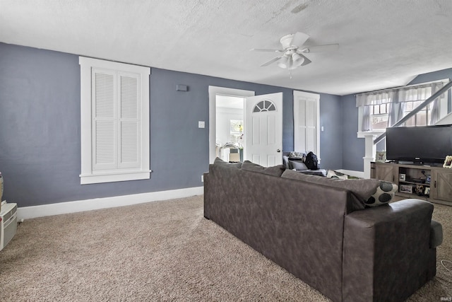 225 N E St, Marion, IN 46952 - living area with carpet floors, ceiling fan, and a textured ceiling