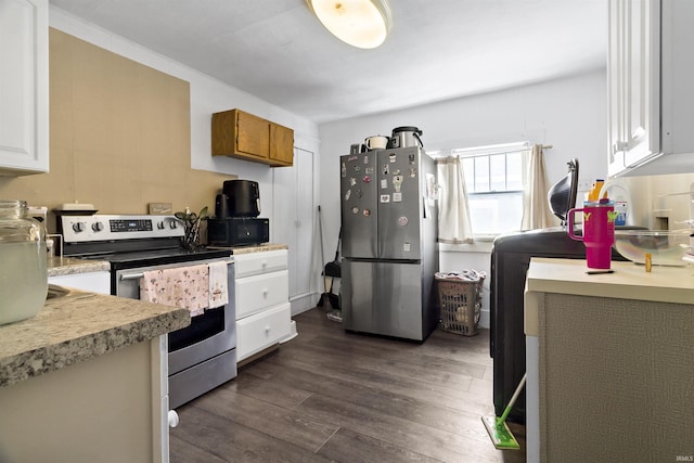 225 N E St, Marion, IN 46952 - kitchen with stainless steel appliances, dark wood-style flooring, light countertops, white cabinetry, and washer / dryer