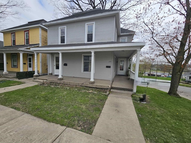 295-297 W Main St, Wabash, IN 46992 - view of front facade featuring a porch and a front lawn