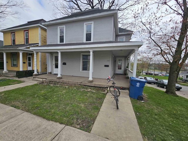 295-297 W Main St, Wabash, IN 46992 - view of front of property featuring a porch and a front lawn