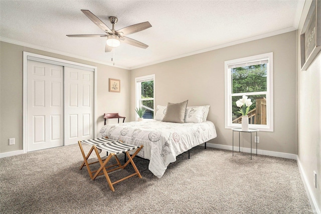 17725 Douglas Rd, South Bend, IN 46635 - bedroom featuring crown molding, carpet, a closet, a textured ceiling, and a ceiling fan