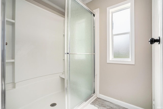 17725 Douglas Rd, South Bend, IN 46635 - bathroom featuring a shower with shower door, ornamental molding, and wood finished floors