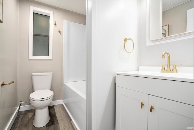 17725 Douglas Rd, South Bend, IN 46635 - full bathroom featuring wood finished floors, vanity, and washtub / shower combination