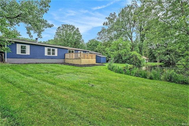 17725 Douglas Rd, South Bend, IN 46635 - view of green lawn with a deck