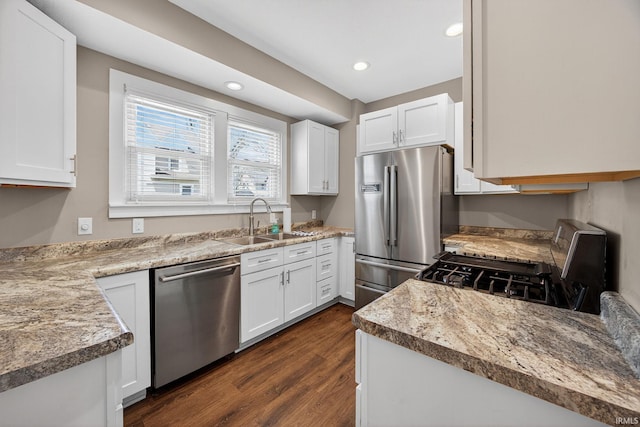 119 Towle Ave, Mishawaka, IN 46544 - kitchen with appliances with stainless steel finishes, white cabinetry, dark wood-type flooring, recessed lighting, and light countertops