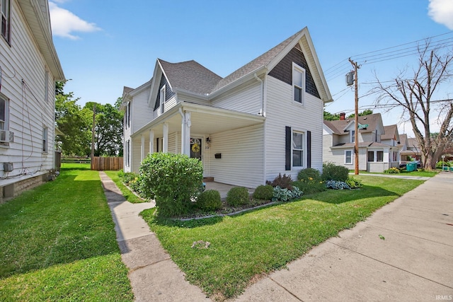 119 Towle Ave, Mishawaka, IN 46544 - view of side of home with roof with shingles and covered porch