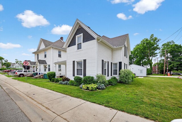119 Towle Ave, Mishawaka, IN 46544 - view of side of property featuring a lawn