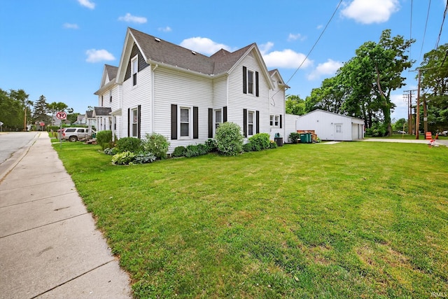 119 Towle Ave, Mishawaka, IN 46544 - view of home's exterior with a yard and a shingled roof