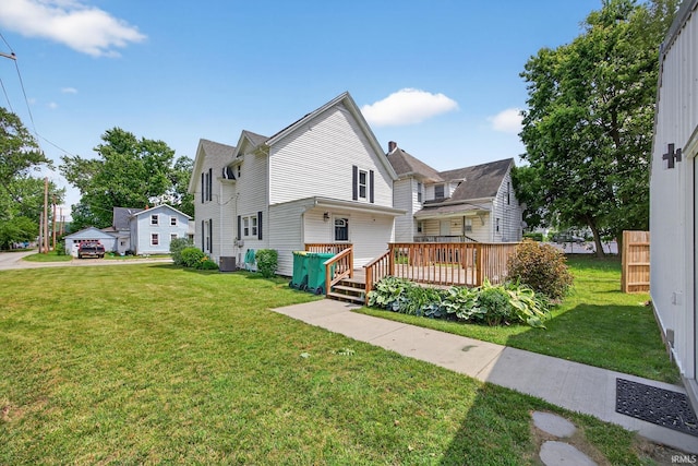 119 Towle Ave, Mishawaka, IN 46544 - view of front of property featuring a front yard and a wooden deck