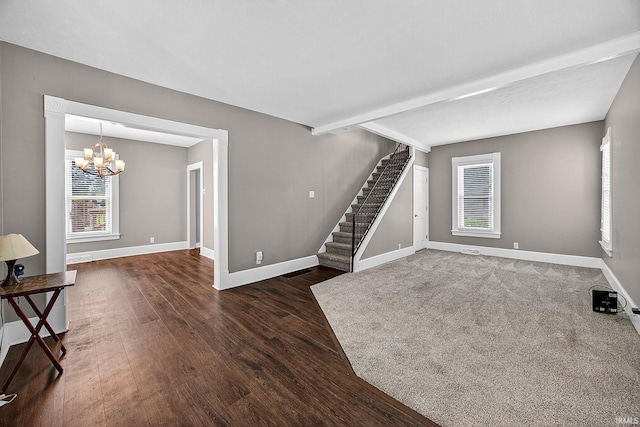 119 Towle Ave, Mishawaka, IN 46544 - unfurnished living room with a chandelier, stairs, and wood finished floors