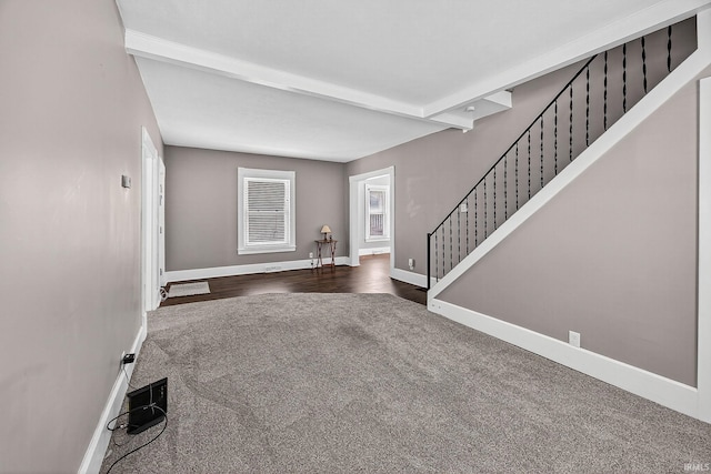 119 Towle Ave, Mishawaka, IN 46544 - foyer featuring dark colored carpet, stairway, and beamed ceiling