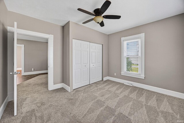 119 Towle Ave, Mishawaka, IN 46544 - unfurnished bedroom with carpet, a closet, and ceiling fan