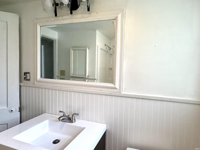 1106 W Rose St, South Bend, IN 46616 - bathroom with a wainscoted wall and vanity