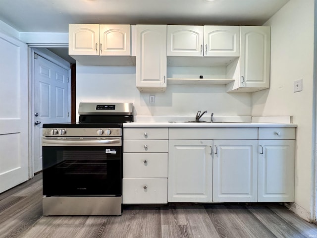 1106 W Rose St, South Bend, IN 46616 - kitchen featuring stainless steel range with electric cooktop, dark wood-style flooring, white cabinetry, light countertops, and open shelves